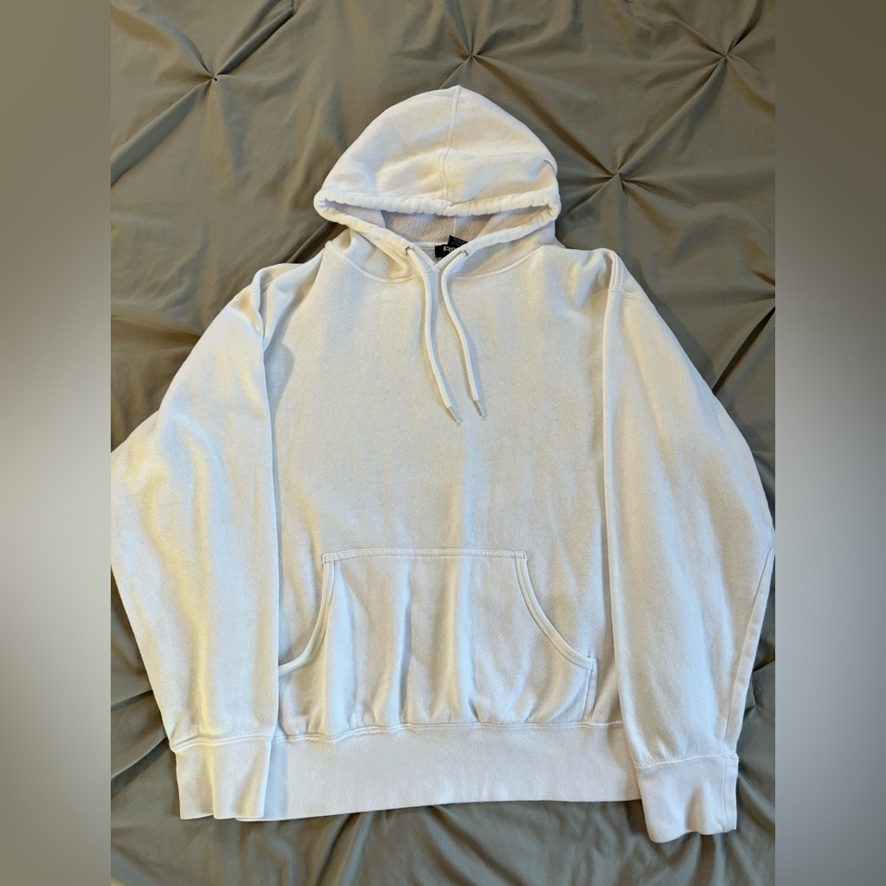 White sweatshirt.